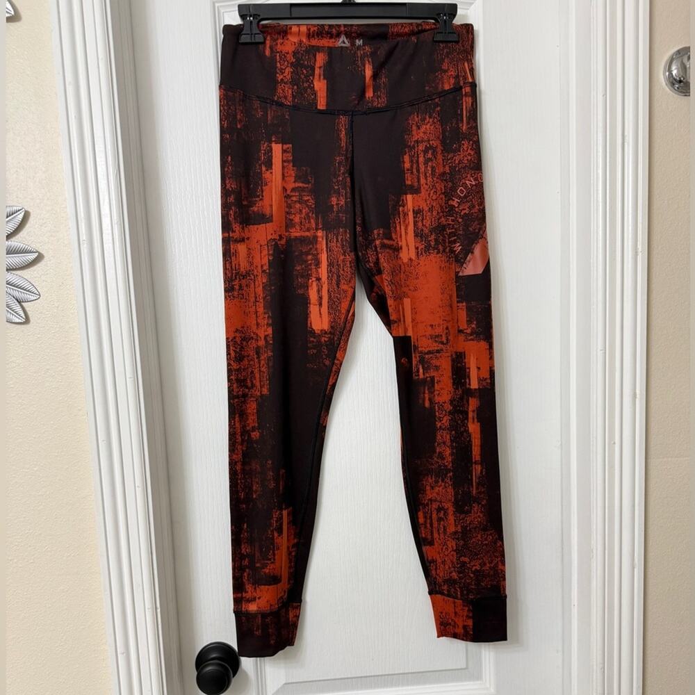 Reebok Combat Lux Bold Tights in a rust orange and coffee brown Size M